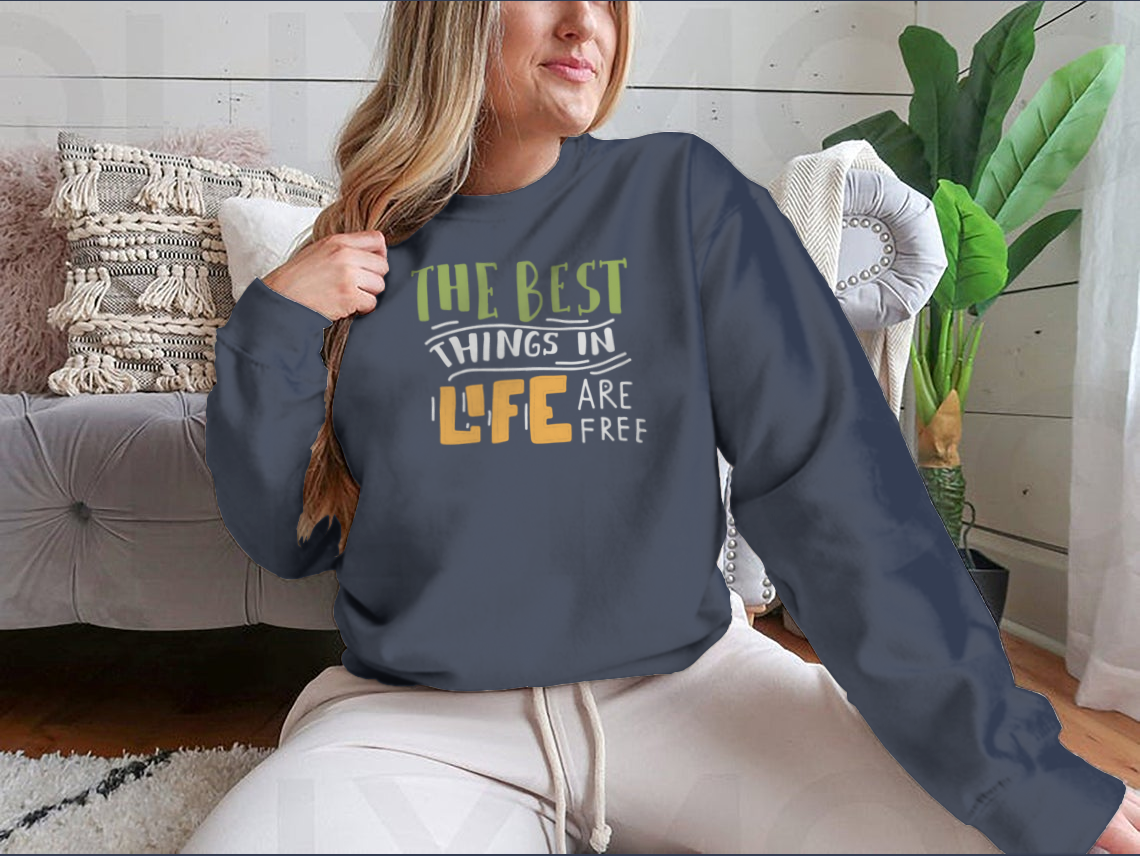A stylish cotton shirt featuring the motivational quote 'The Best Things In Life Are Free' in elegant hand lettering design.