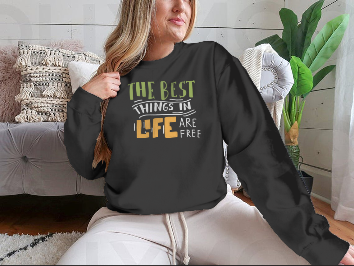 A stylish cotton shirt featuring the motivational quote 'The Best Things In Life Are Free' in elegant hand lettering design.