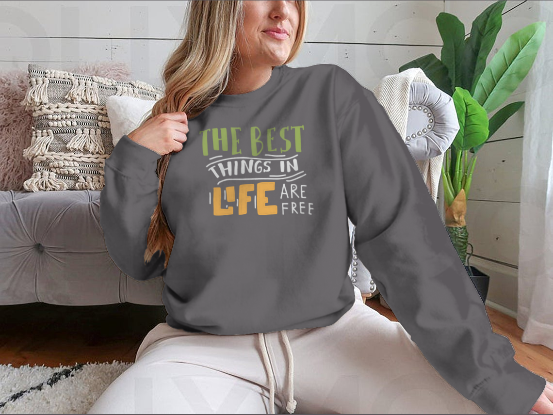 A stylish cotton shirt featuring the motivational quote 'The Best Things In Life Are Free' in elegant hand lettering design.
