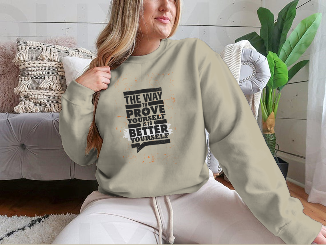 A cozy sweatshirt featuring the motivational phrase 'The Way To Prove Yourself Is To Better Yourself', made from a soft cotton-polyester blend.