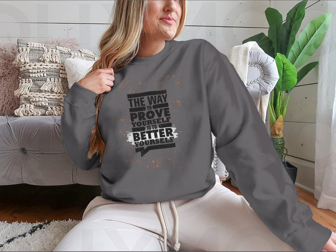 A cozy sweatshirt featuring the motivational phrase 'The Way To Prove Yourself Is To Better Yourself', made from a soft cotton-polyester blend.
