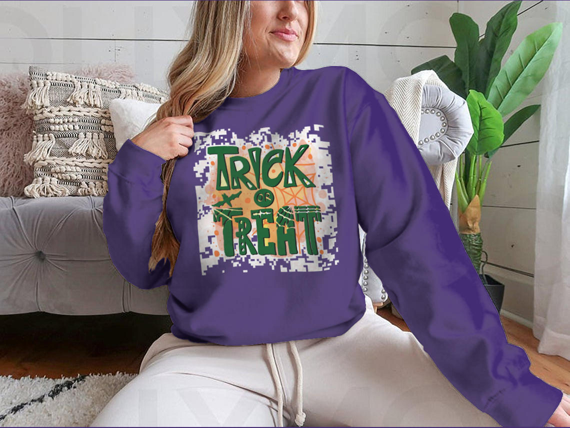 A cozy Trick Or Treat sweatshirt designed for Halloween, featuring a classic fit and festive graphics.