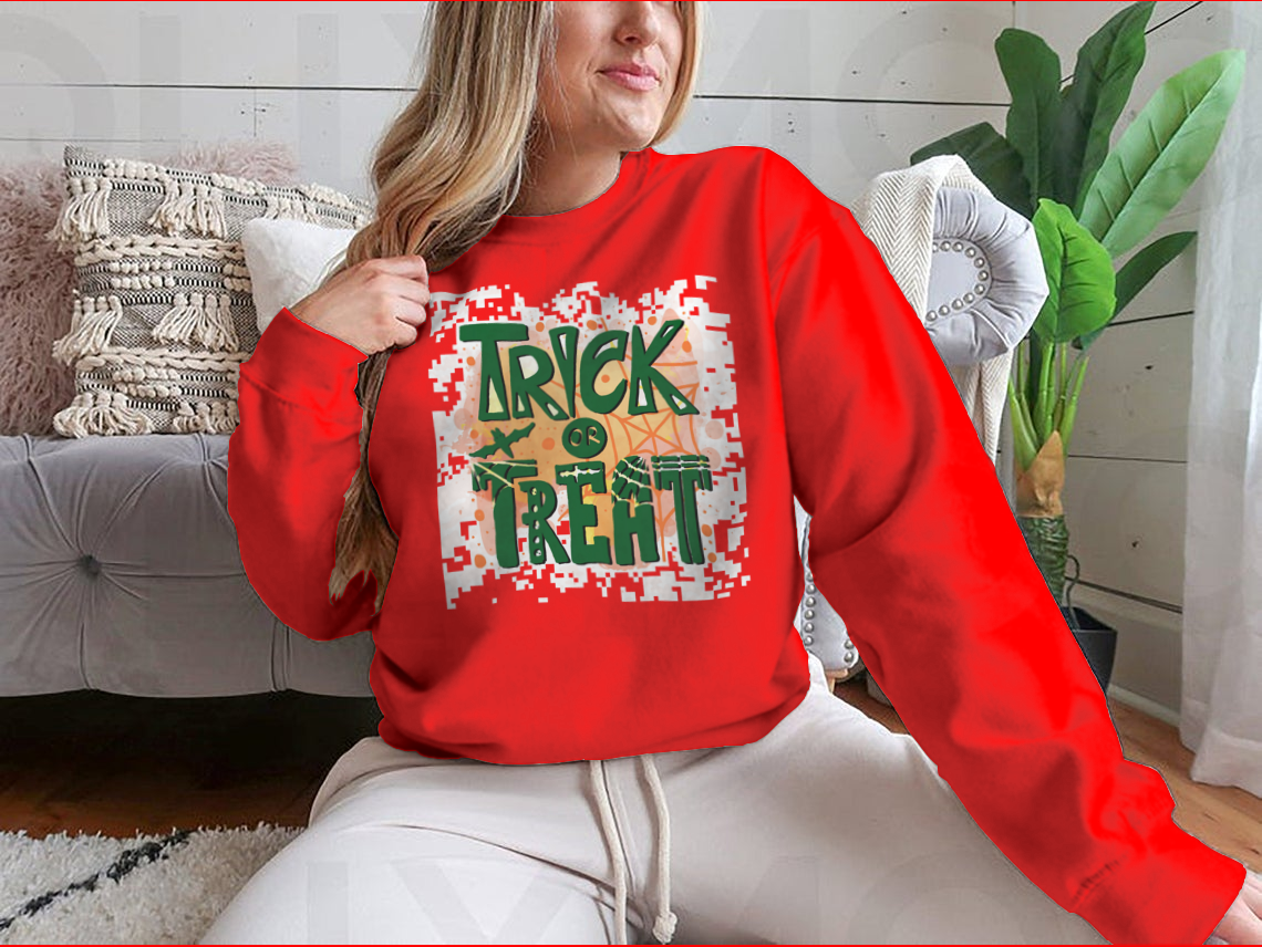 A cozy Trick Or Treat sweatshirt designed for Halloween, featuring a classic fit and festive graphics.