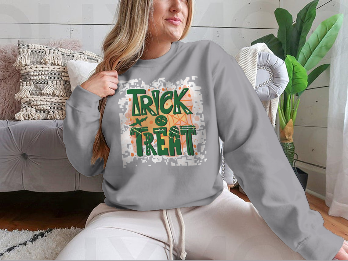 A cozy Trick Or Treat sweatshirt designed for Halloween, featuring a classic fit and festive graphics.