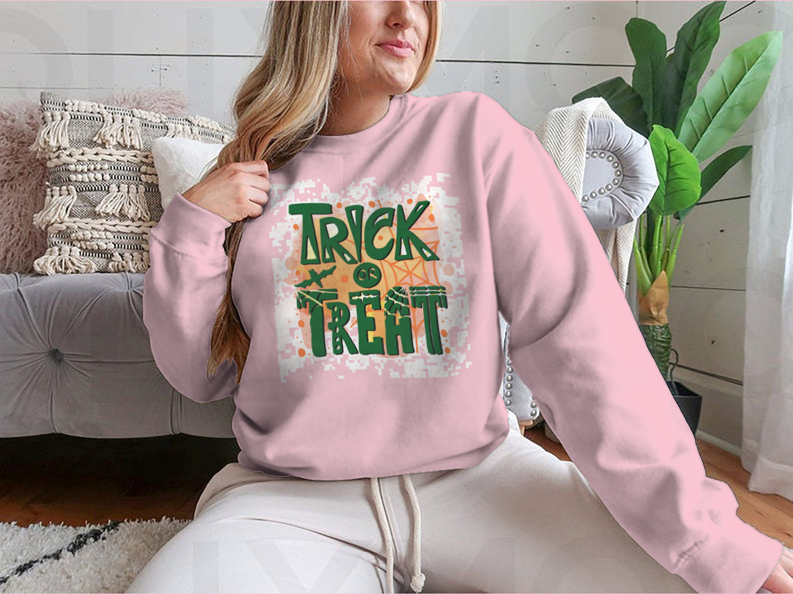 A cozy Trick Or Treat sweatshirt designed for Halloween, featuring a classic fit and festive graphics.