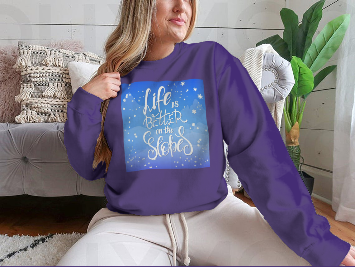 A cozy winter-themed t-shirt featuring snowflakes and a mountain flare design, perfect for chilly weather.