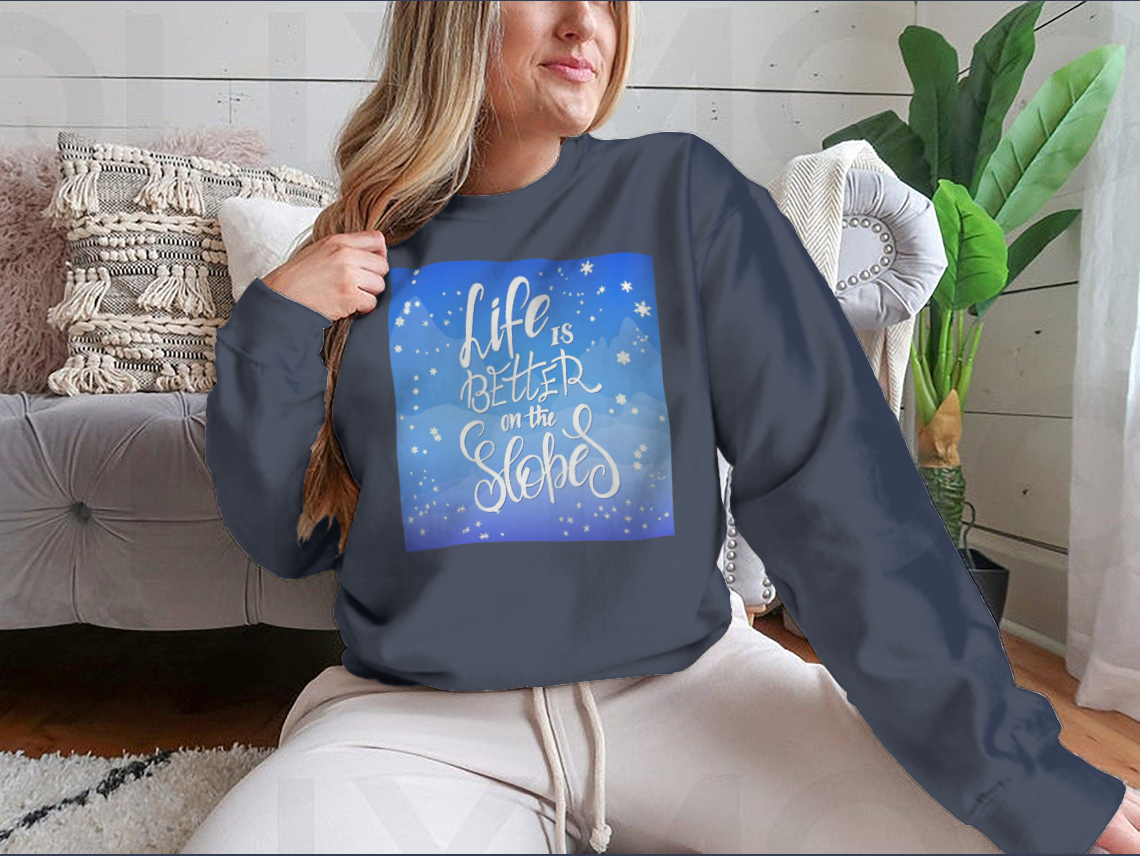 A cozy winter-themed t-shirt featuring snowflakes and a mountain flare design, perfect for chilly weather.