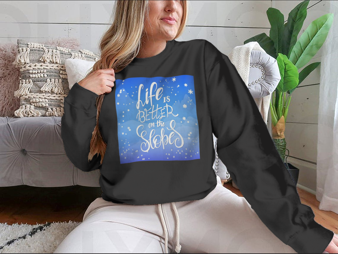 A cozy winter-themed t-shirt featuring snowflakes and a mountain flare design, perfect for chilly weather.