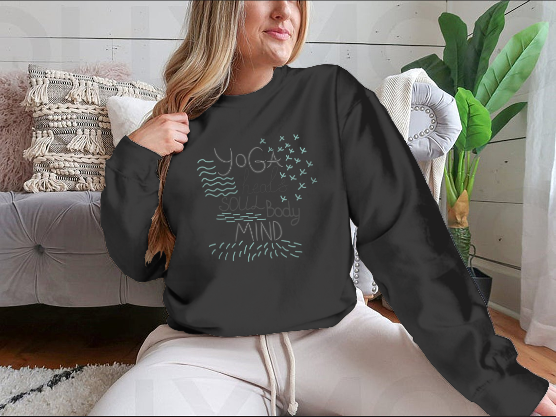 A motivational quote design featuring 'Yoga Heals The Body Soul Mind' on a comfortable cotton-polyester blend fabric, perfect for yoga enthusiasts.