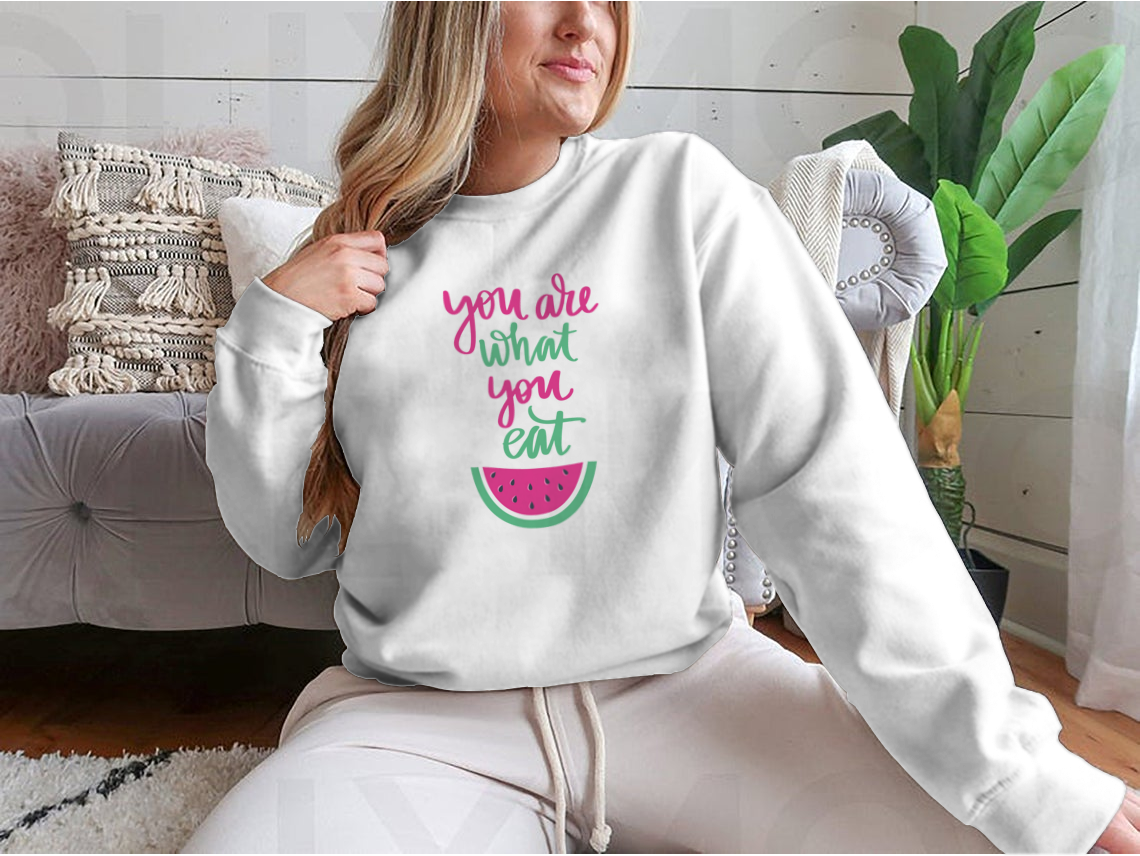 A stylish sweatshirt featuring the motivational quote 'You Are What You Eat', made from a comfortable cotton/polyester blend.