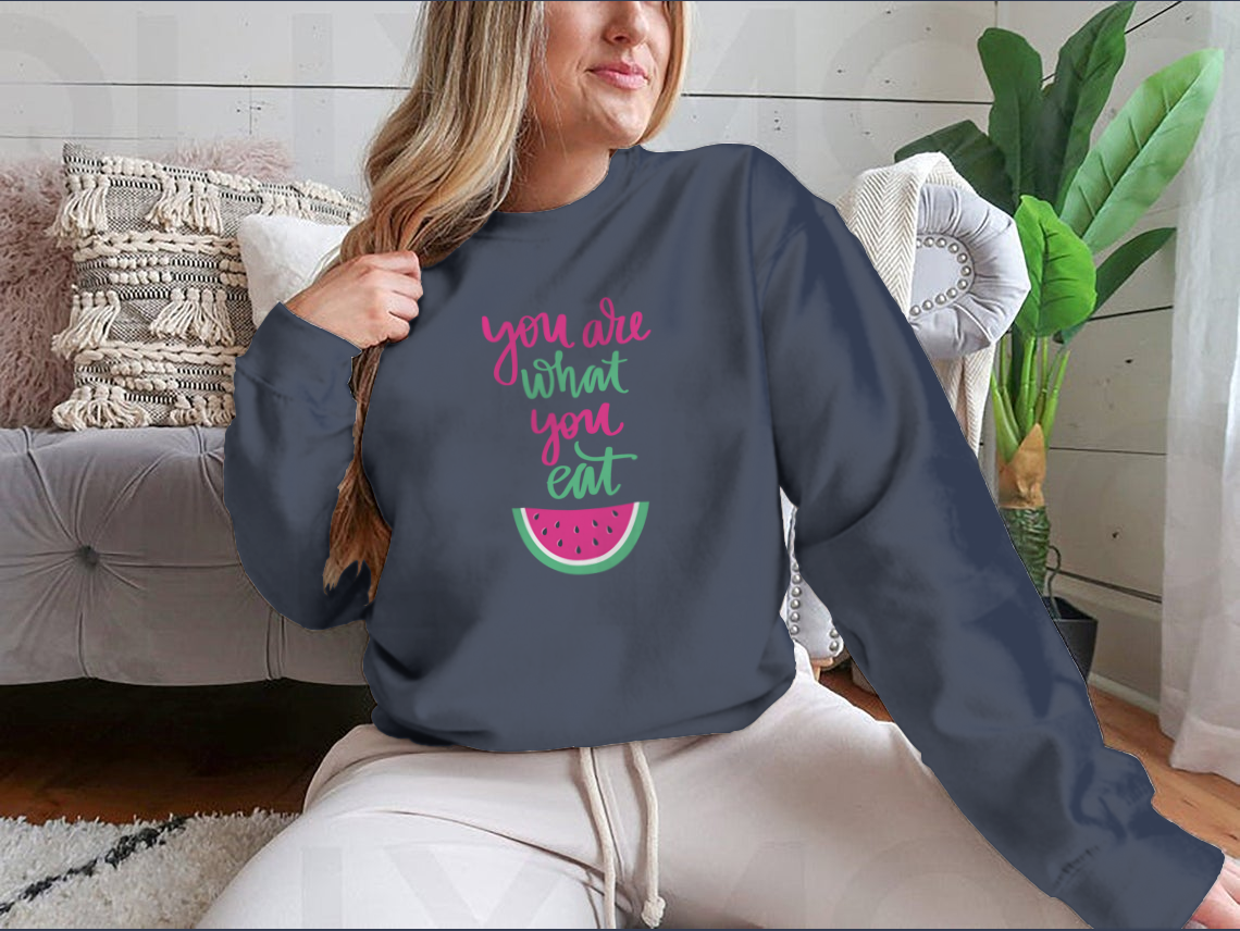 A stylish sweatshirt featuring the motivational quote 'You Are What You Eat', made from a comfortable cotton/polyester blend.