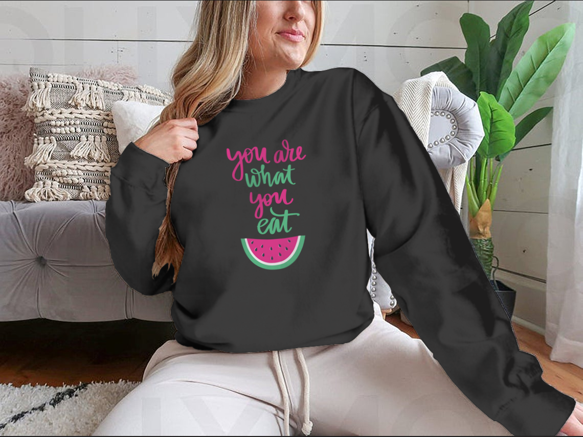 A stylish sweatshirt featuring the motivational quote 'You Are What You Eat', made from a comfortable cotton/polyester blend.