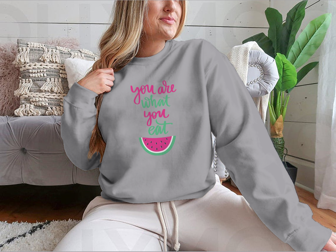 A stylish sweatshirt featuring the motivational quote 'You Are What You Eat', made from a comfortable cotton/polyester blend.
