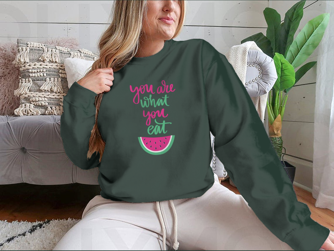 A stylish sweatshirt featuring the motivational quote 'You Are What You Eat', made from a comfortable cotton/polyester blend.
