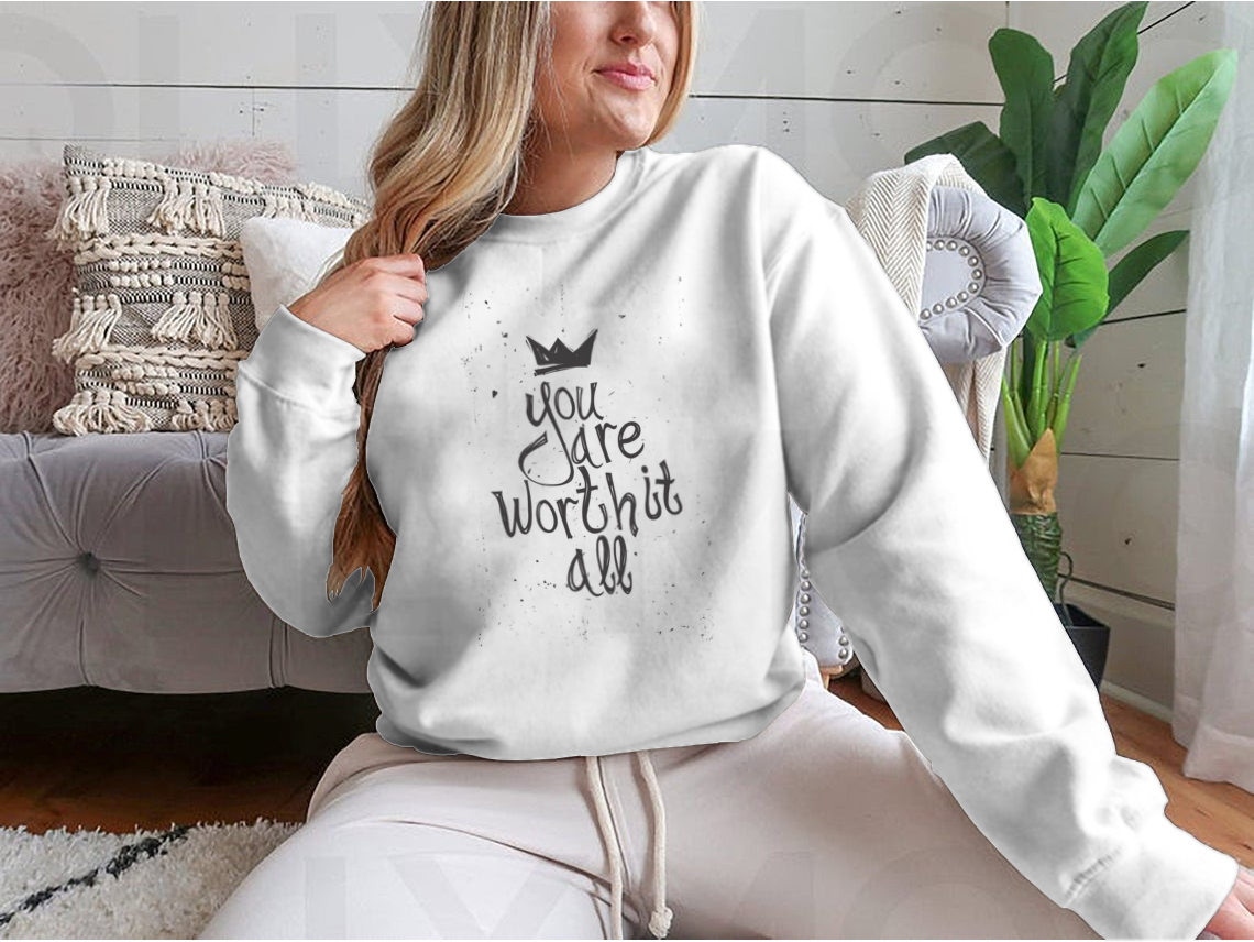 A cozy sweatshirt featuring the motivational phrase 'You Are Worth It All' in stylish typography, perfect for casual wear.