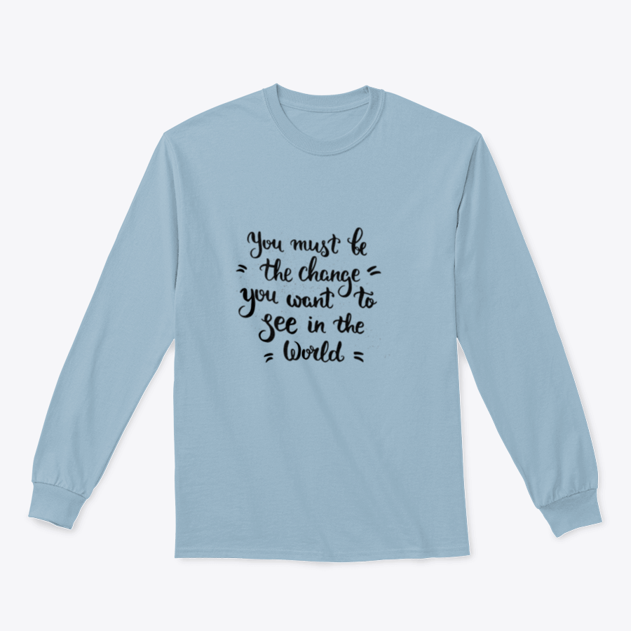 A cozy sweatshirt featuring the inspirational phrase 'You Must Change' in a stylish design, perfect for casual wear.