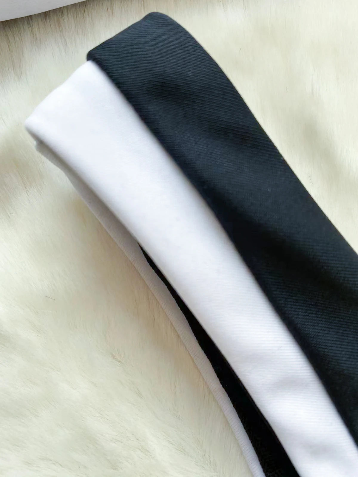 Stylish Beatz two piece swimsuit in black, featuring a trendy patchwork design and wire-free support, perfect for summer beach outings.