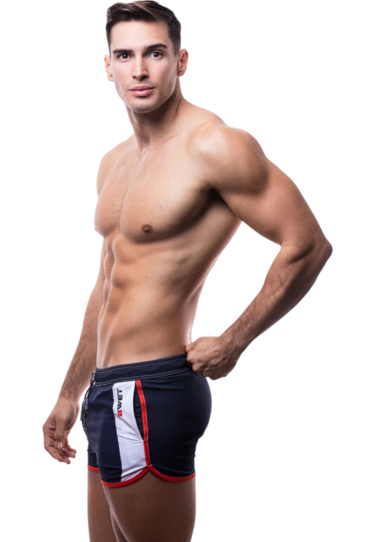 Trendy La Barceloneta Beach Shorts featuring an elastic waistband, adjustable drawstrings, and side pockets, perfect for summer beach activities.