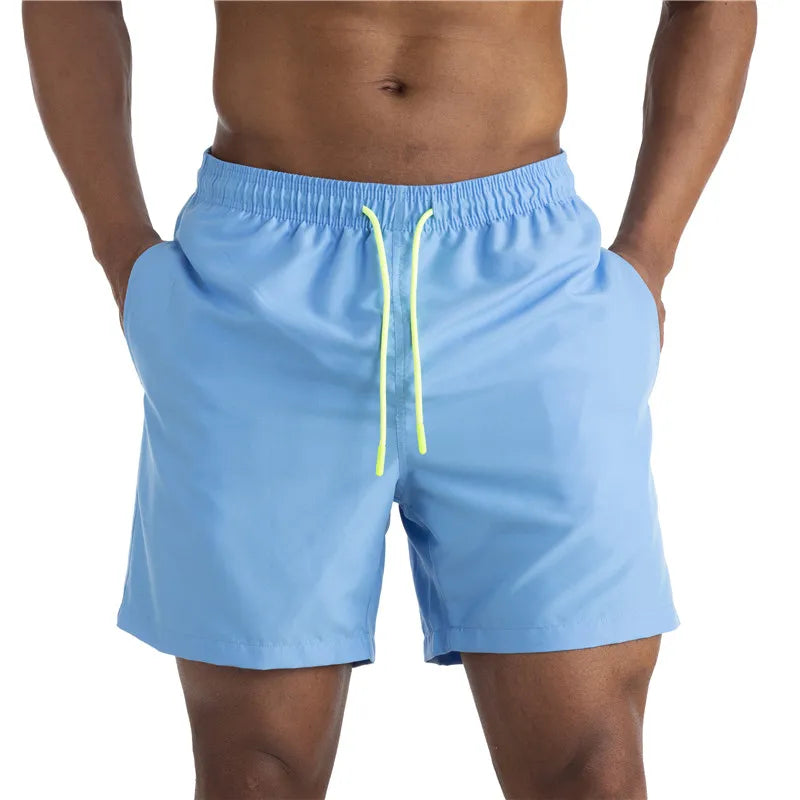 Sunga Beach Shorts in solid pattern, made of durable polyester, designed for men's swimming and beach activities.