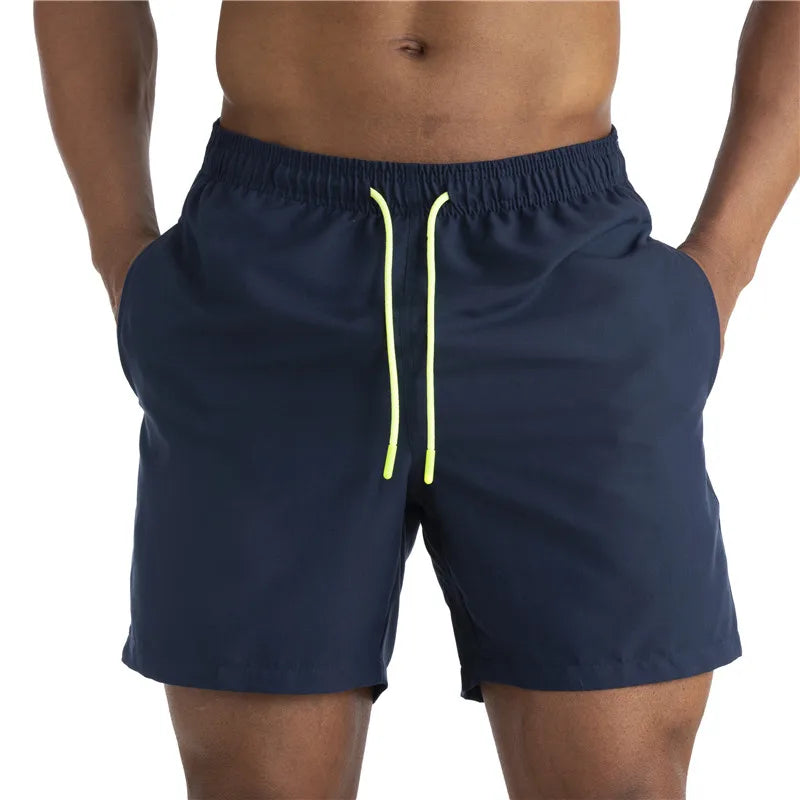 Sunga Beach Shorts in solid pattern, made of durable polyester, designed for men's swimming and beach activities.