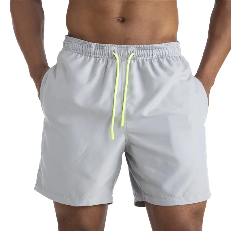 Sunga Beach Shorts in solid pattern, made of durable polyester, designed for men's swimming and beach activities.
