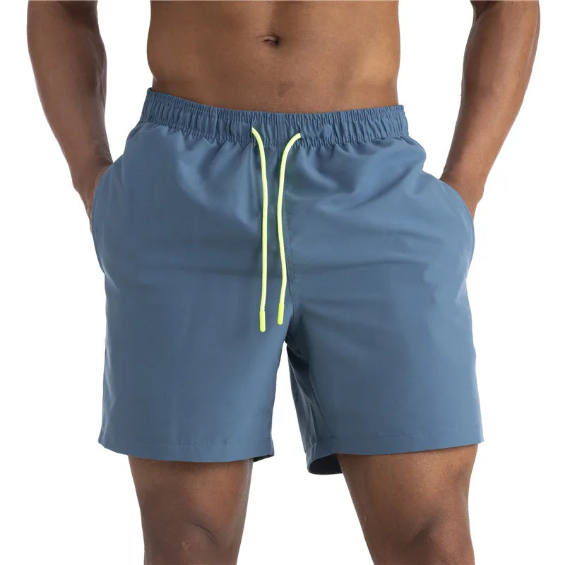 Sunga Beach Shorts in solid pattern, made of durable polyester, designed for men's swimming and beach activities.