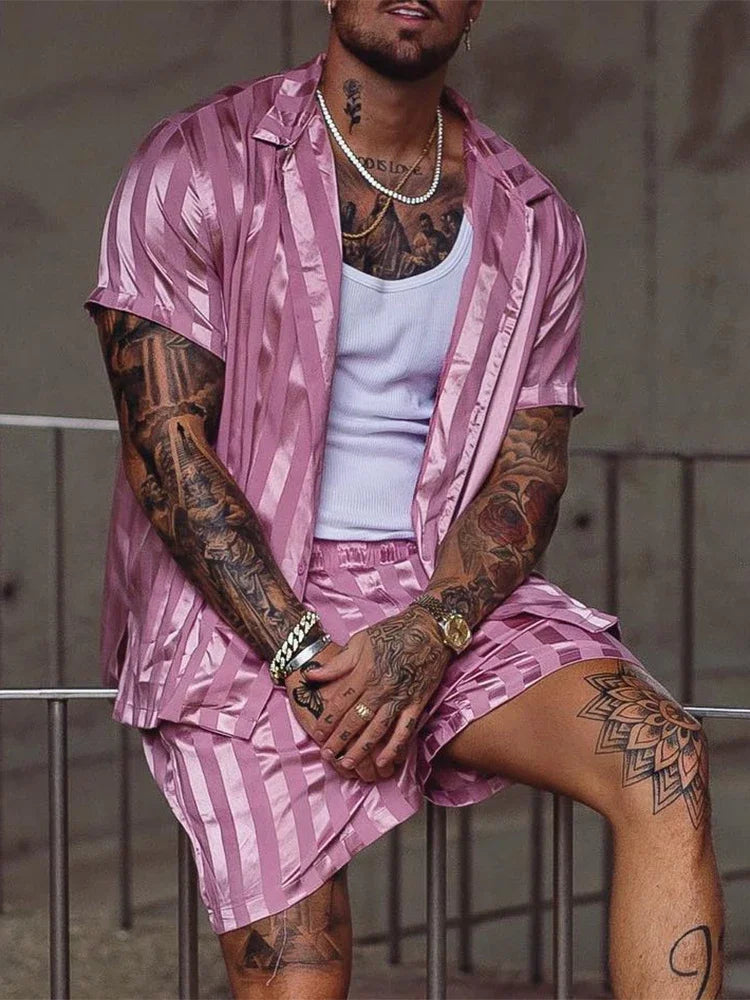 Trendy men two piece beach set featuring a stylish print design, full sleeve top, and drawstring pants, perfect for casual summer outings.