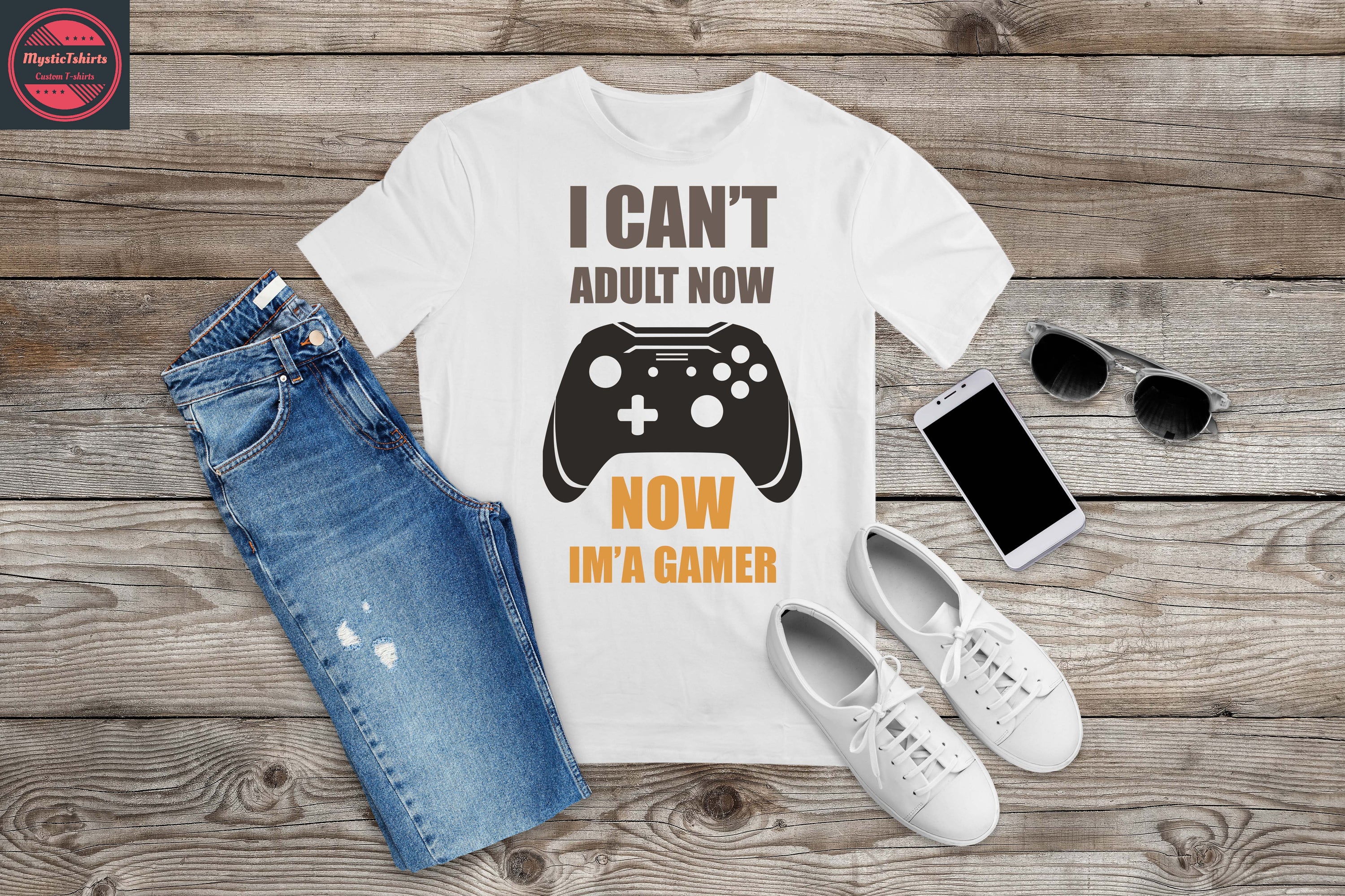 Custom made shirt featuring the phrase 'I CAN'T ADULT NOW, NOW IM'A GAMER' in vibrant colors on a high-quality fabric.