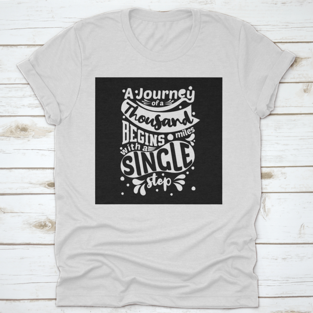 Premium cotton t-shirt featuring the phrase 'A Journey Of A Thousand Miles Begins With A Single Step' in a classic fit.
