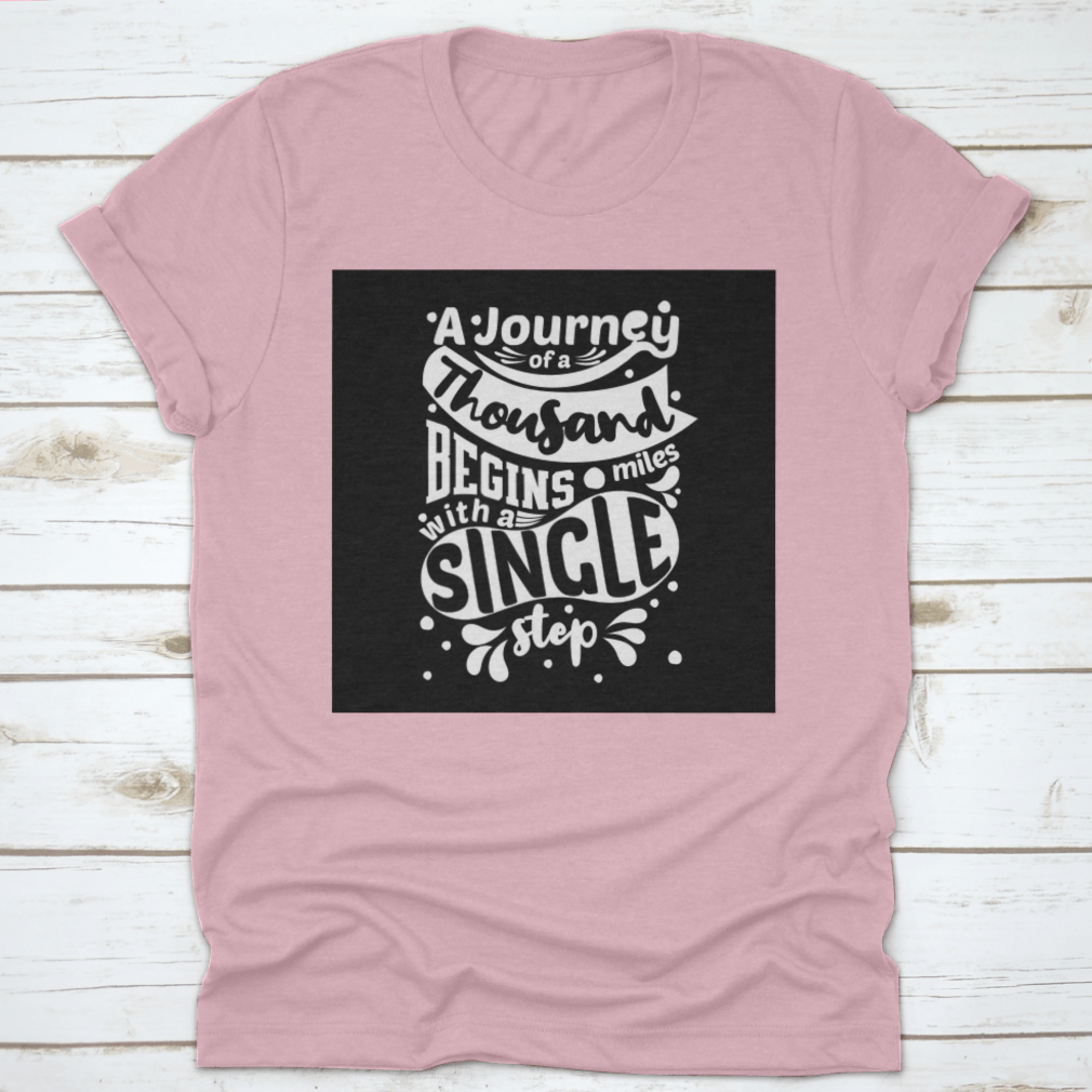 Premium cotton t-shirt featuring the phrase 'A Journey Of A Thousand Miles Begins With A Single Step' in a classic fit.