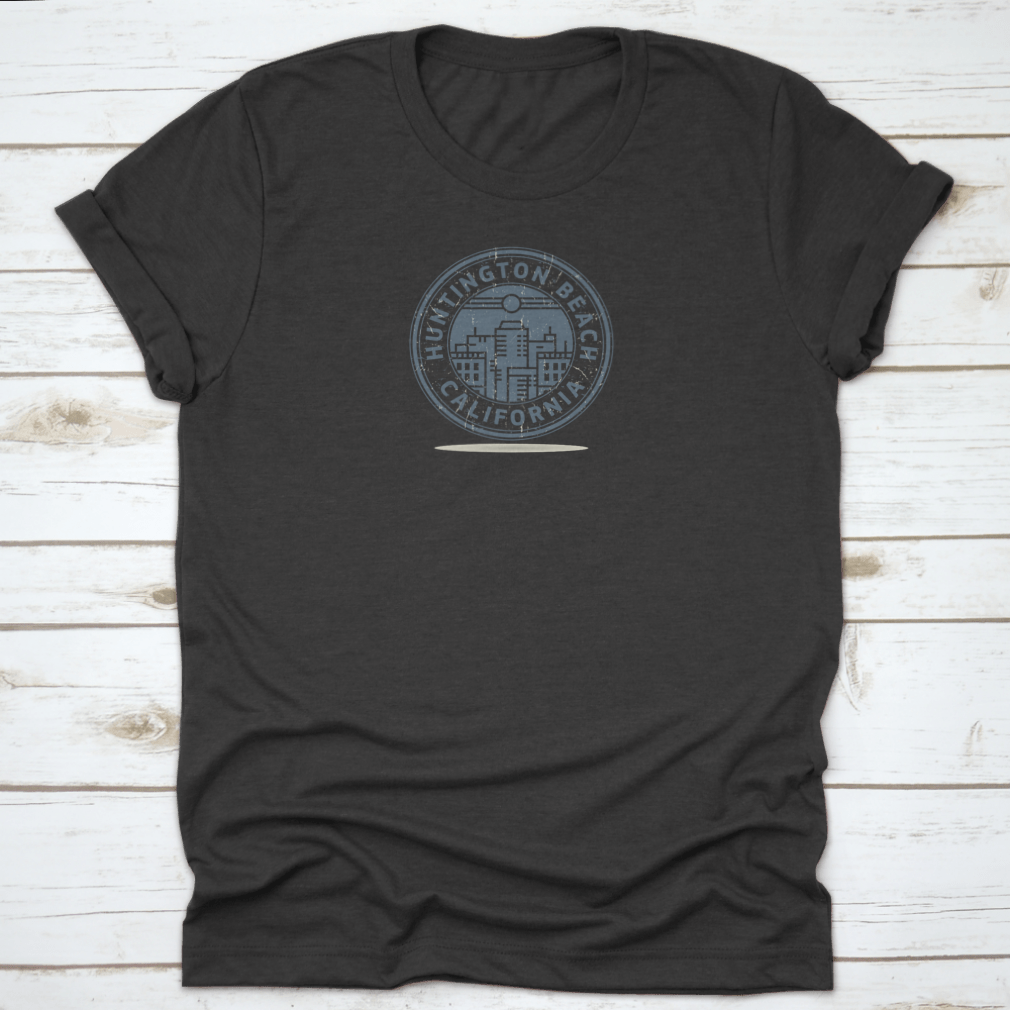 A stylish t-shirt featuring a stamp design of Huntington Beach, California, showcasing vibrant colors and a comfortable fit.
