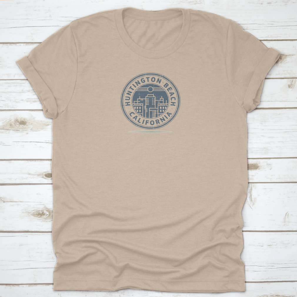 A stylish t-shirt featuring a stamp design of Huntington Beach, California, showcasing vibrant colors and a comfortable fit.