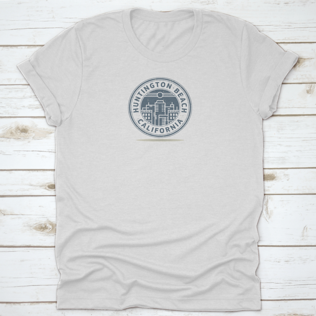 A stylish t-shirt featuring a stamp design of Huntington Beach, California, showcasing vibrant colors and a comfortable fit.