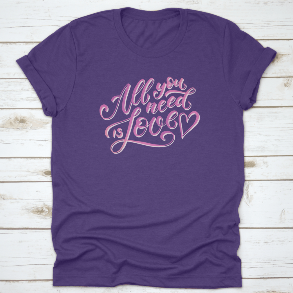 A stylish All You Need Is Love T-Shirt featuring hand-drawn lettering design, made from 100% cotton for comfort.