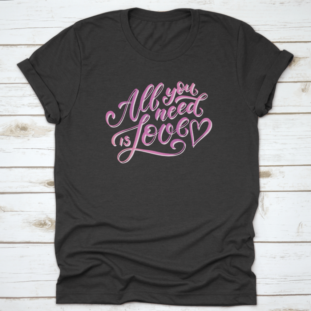 A stylish All You Need Is Love T-Shirt featuring hand-drawn lettering design, made from 100% cotton for comfort.