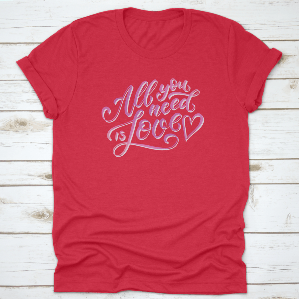 A stylish All You Need Is Love T-Shirt featuring hand-drawn lettering design, made from 100% cotton for comfort.