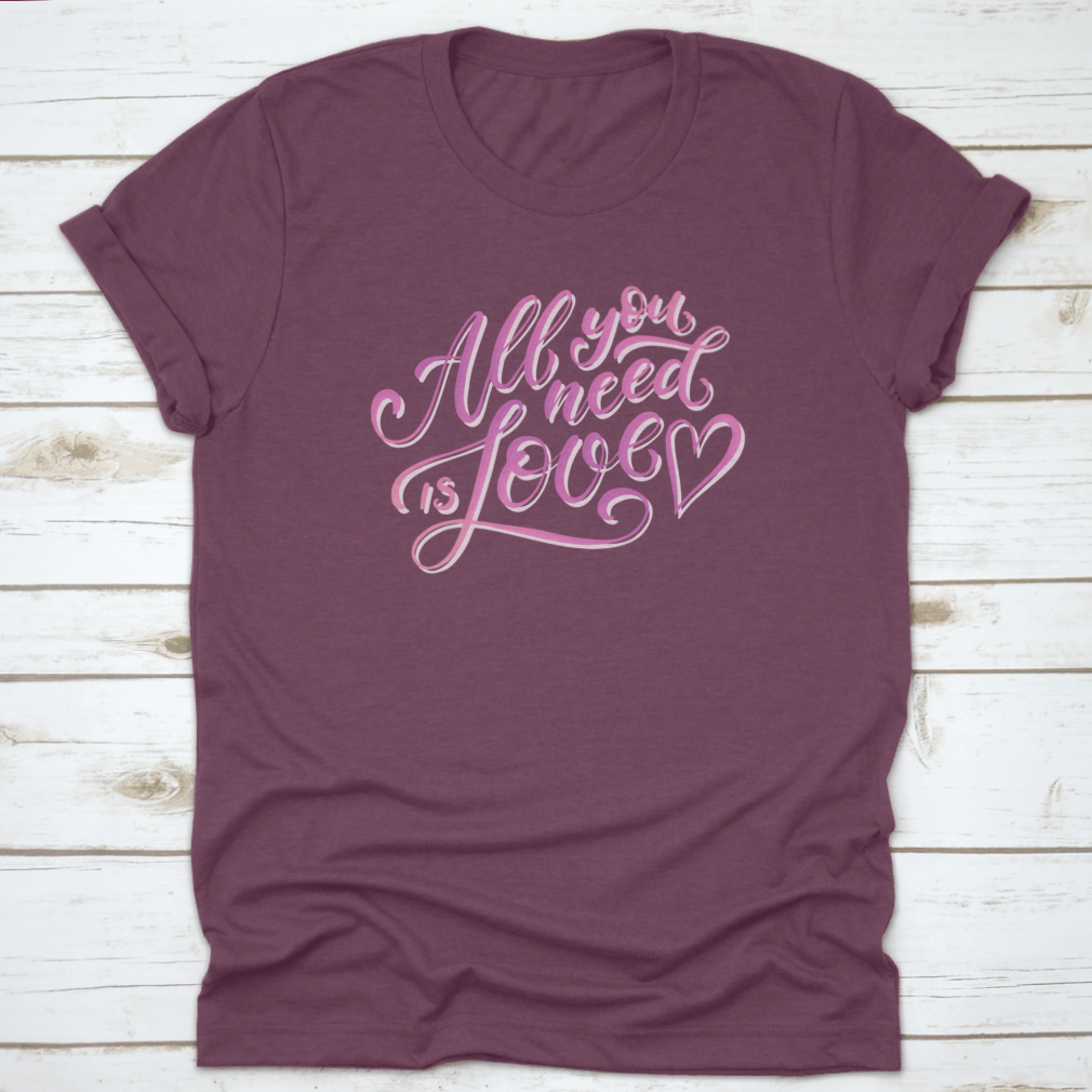 A stylish All You Need Is Love T-Shirt featuring hand-drawn lettering design, made from 100% cotton for comfort.