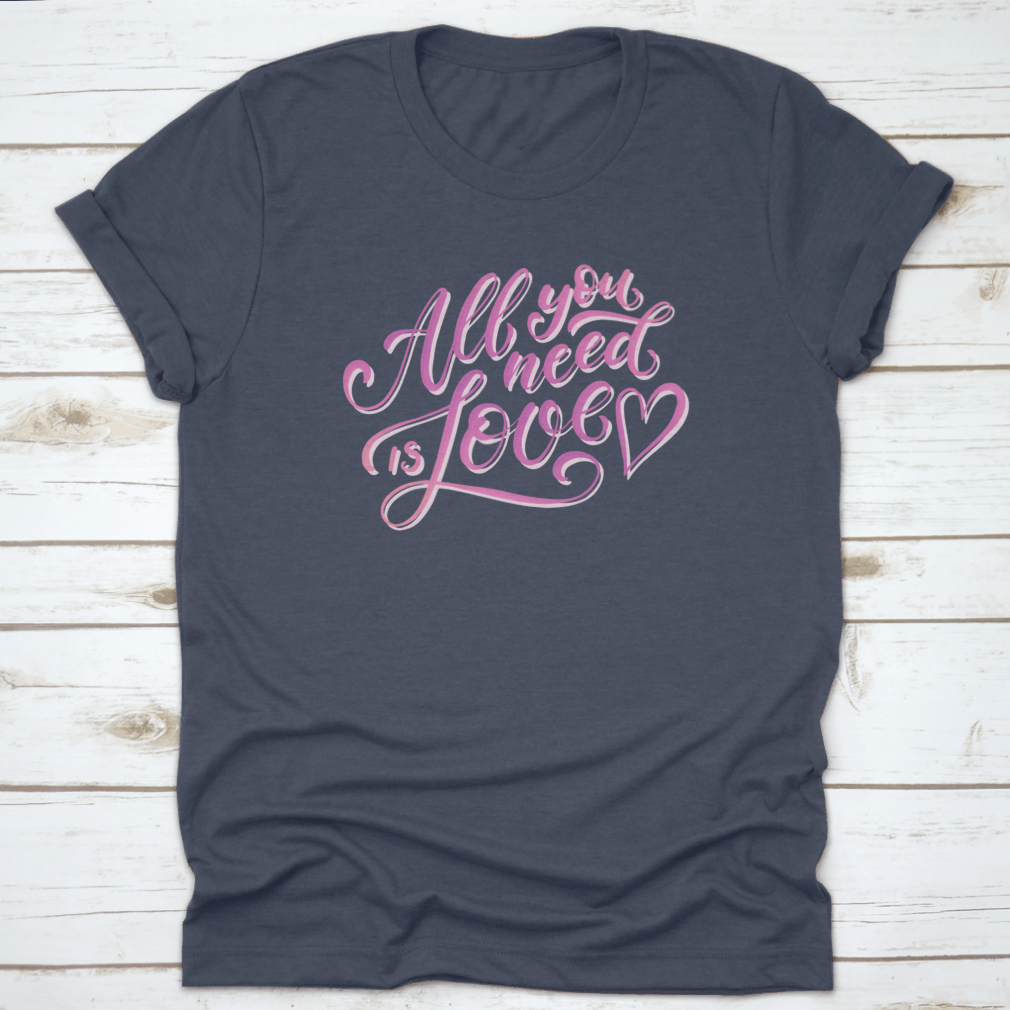 A stylish All You Need Is Love T-Shirt featuring hand-drawn lettering design, made from 100% cotton for comfort.