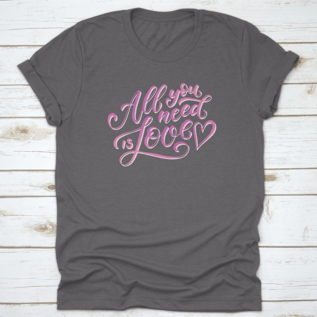 A stylish All You Need Is Love T-Shirt featuring hand-drawn lettering design, made from 100% cotton for comfort.