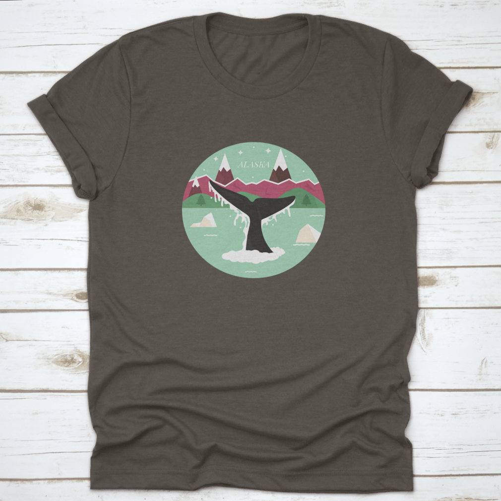 Alaska Glacial Landscape T-shirt featuring a whale logo icon, showcasing a scenic design with mountains and forests.