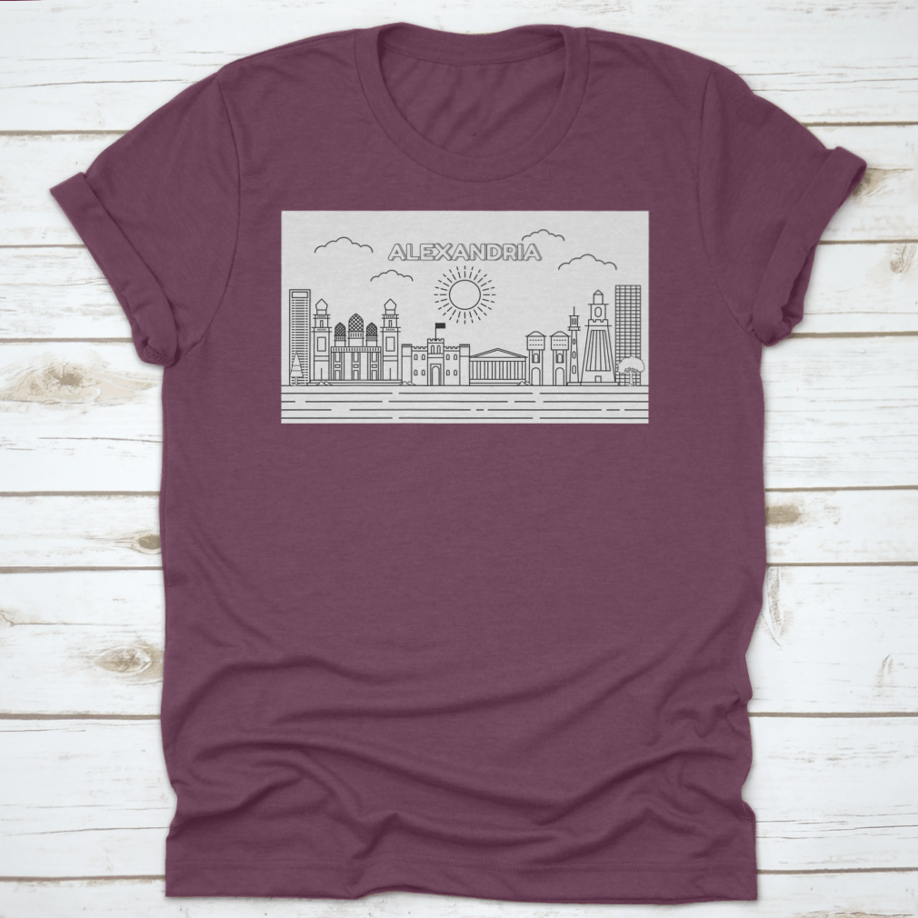 A stylish t-shirt featuring a line art illustration of the Alexandria skyline, showcasing its iconic buildings and structures.