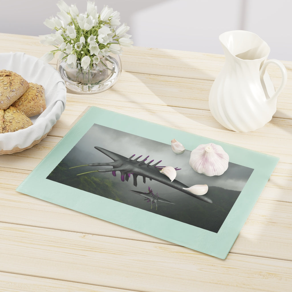 Alpha Creature Cutting Board made of tempered glass with rubber dots for stability, showcasing a unique design.