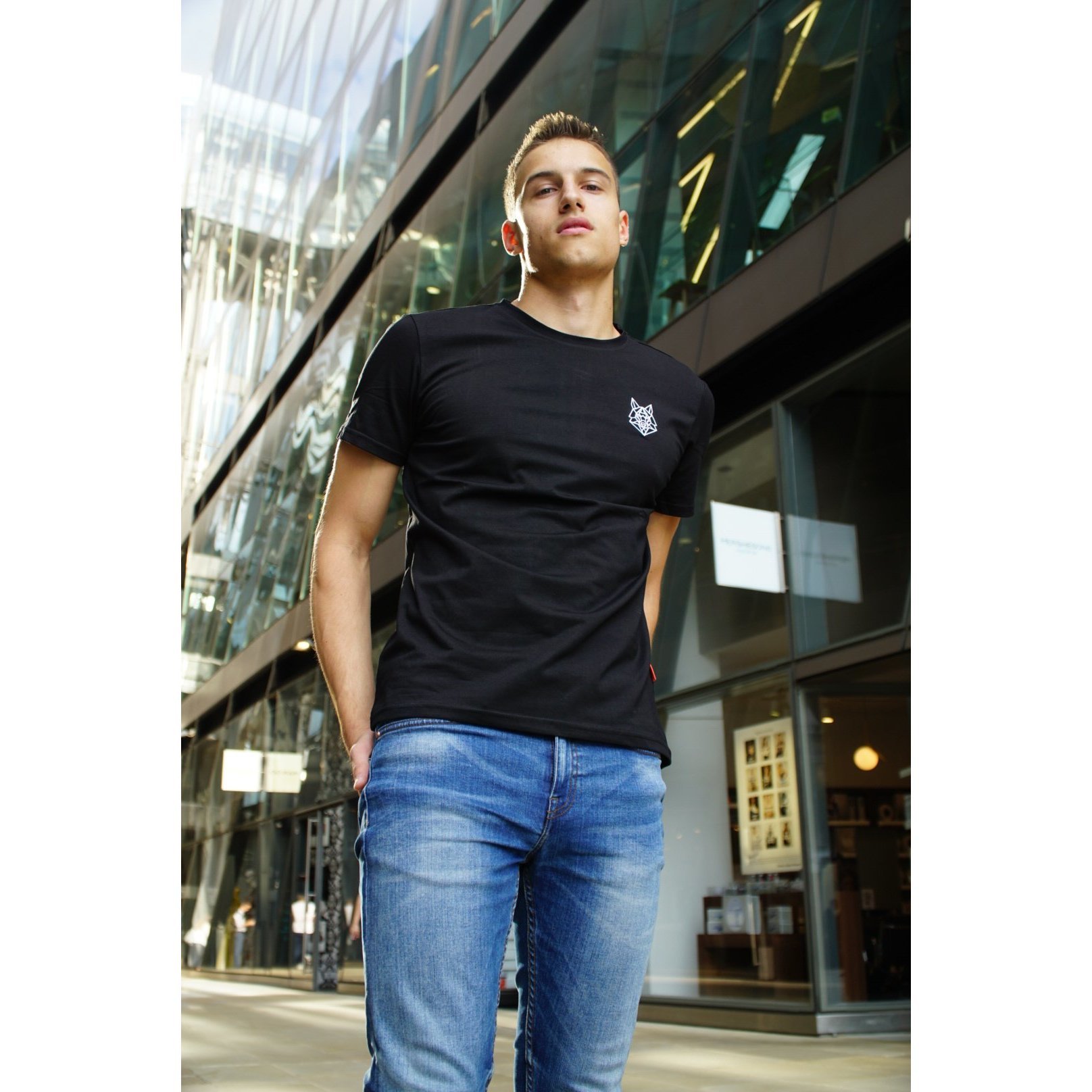 Alpha Wolfe Signature Black T-shirt featuring a fitted design and white embroidered logo on the chest.