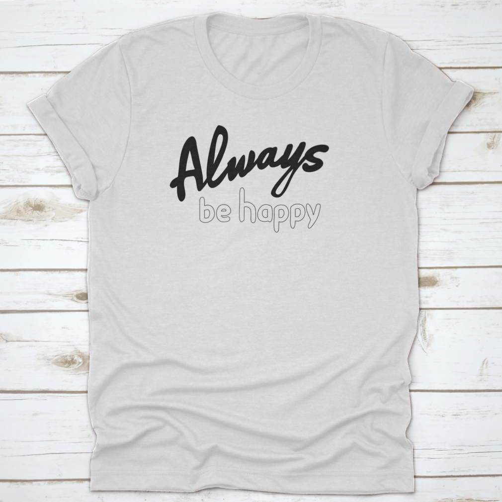 A stylish 'Always Be Happy' Bible verse quote shirt made from 100% cotton, showcasing a motivational design perfect for casual wear.