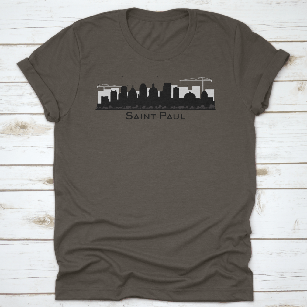 A stylish black t-shirt featuring the silhouette of the Saint Paul Minnesota city skyline, showcasing iconic buildings.