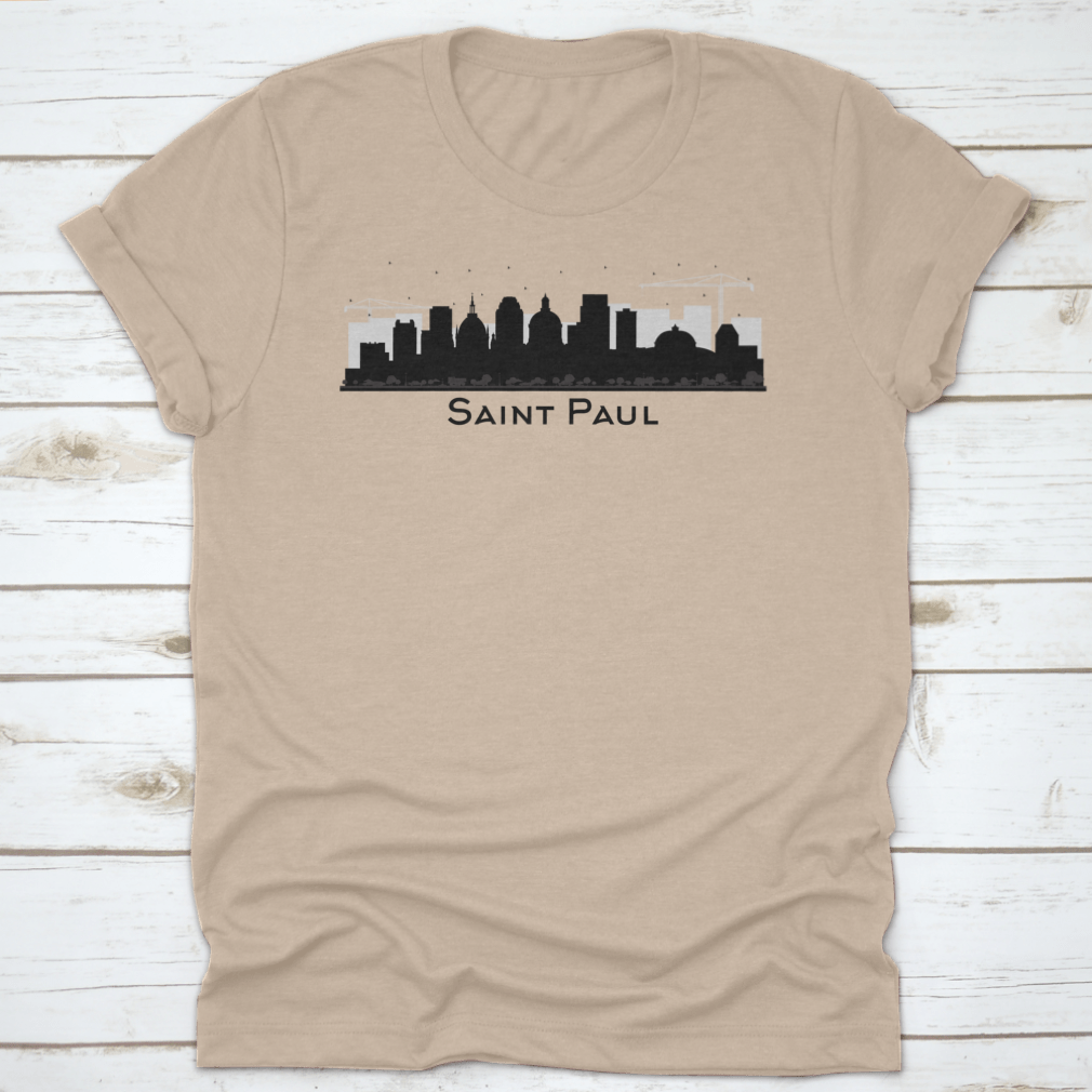 A stylish black t-shirt featuring the silhouette of the Saint Paul Minnesota city skyline, showcasing iconic buildings.