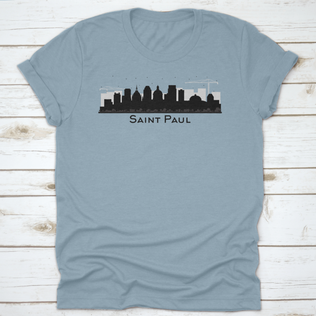 A stylish black t-shirt featuring the silhouette of the Saint Paul Minnesota city skyline, showcasing iconic buildings.