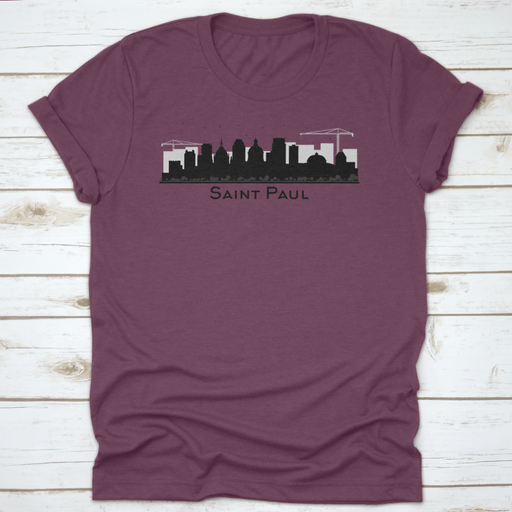 A stylish black t-shirt featuring the silhouette of the Saint Paul Minnesota city skyline, showcasing iconic buildings.