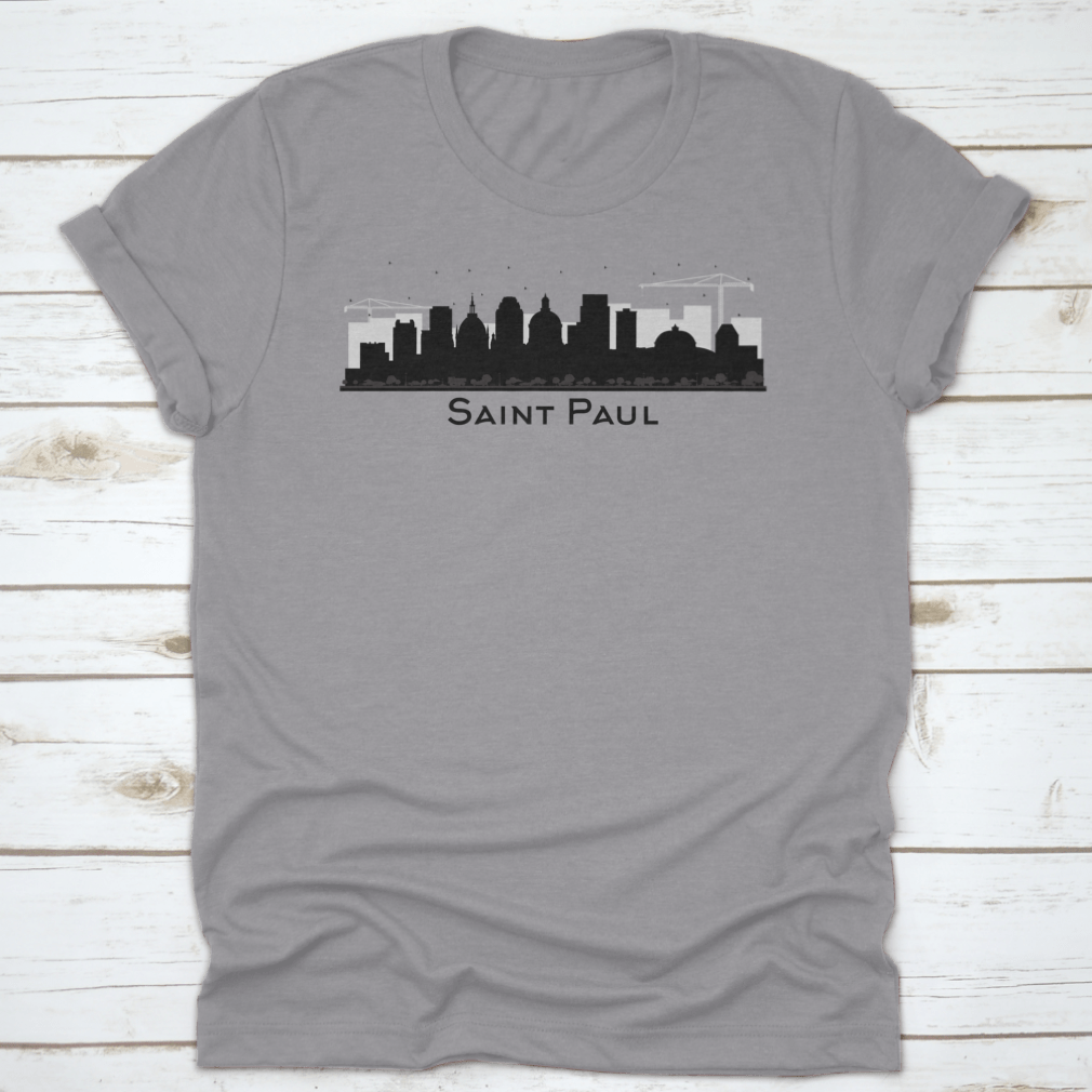 A stylish black t-shirt featuring the silhouette of the Saint Paul Minnesota city skyline, showcasing iconic buildings.