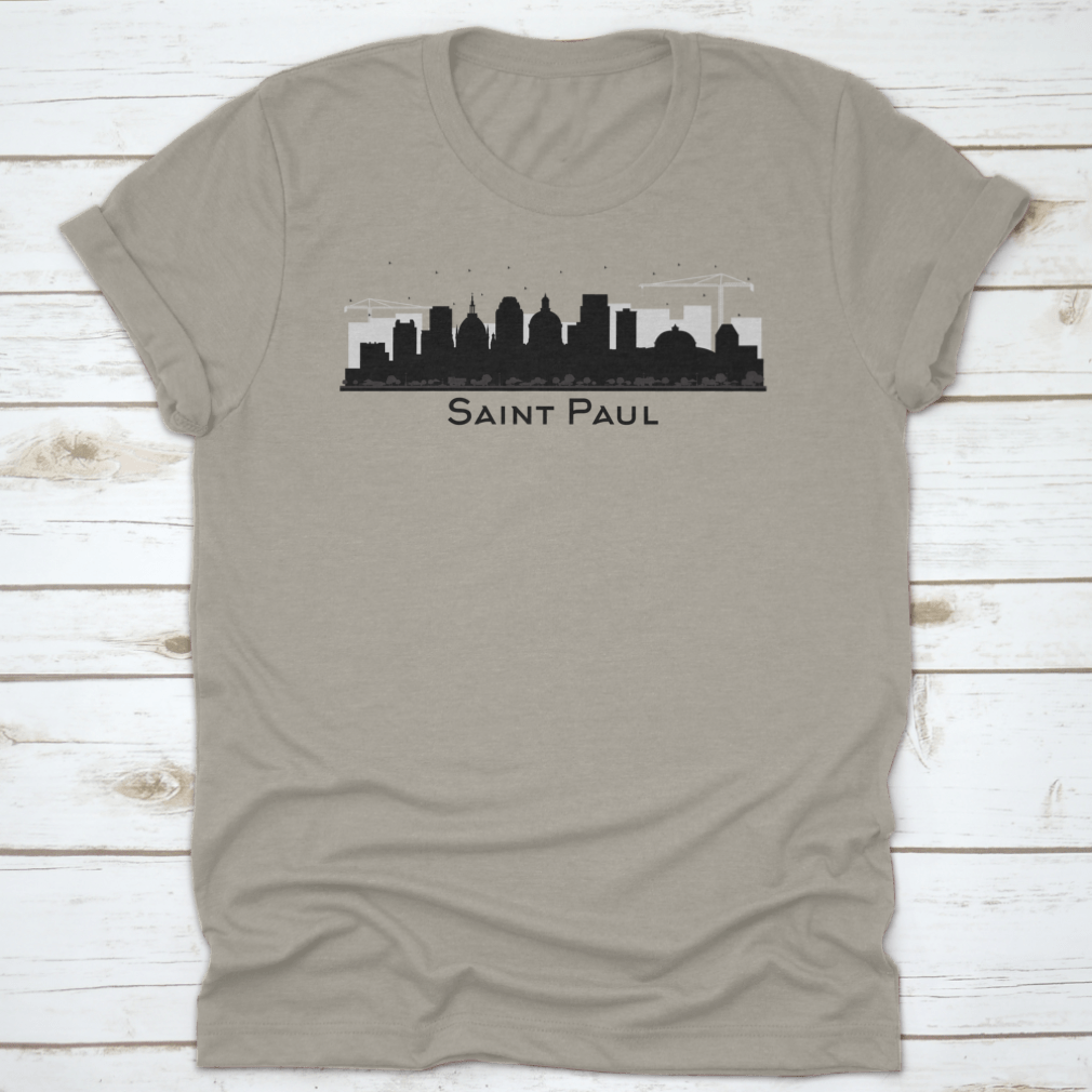 A stylish black t-shirt featuring the silhouette of the Saint Paul Minnesota city skyline, showcasing iconic buildings.